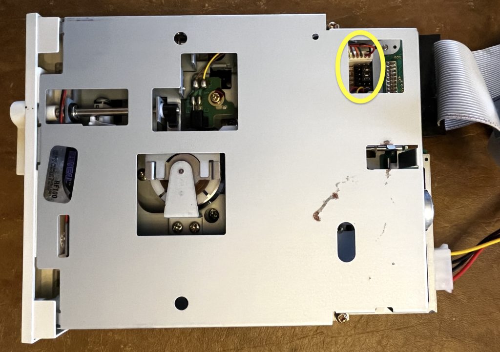5.25 floppy disk drive. Top right corner circled showing where the jumpers are located