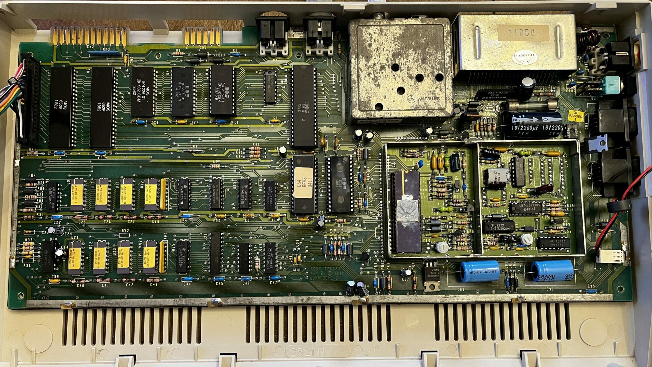 commodore 64 control board showing inside banks of IC chips